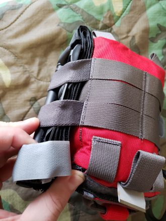 A photo of the FATpack's external elastic catching on a tourniquet. 